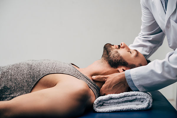 Man on a massage table receiving a Chiropractic Massage in Lehi, Utah